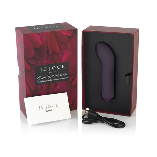 A purple bullet vibrator displayed in its open box, with the brand name Je Joue visible. The packaging includes a product card and a USB recharge cable.