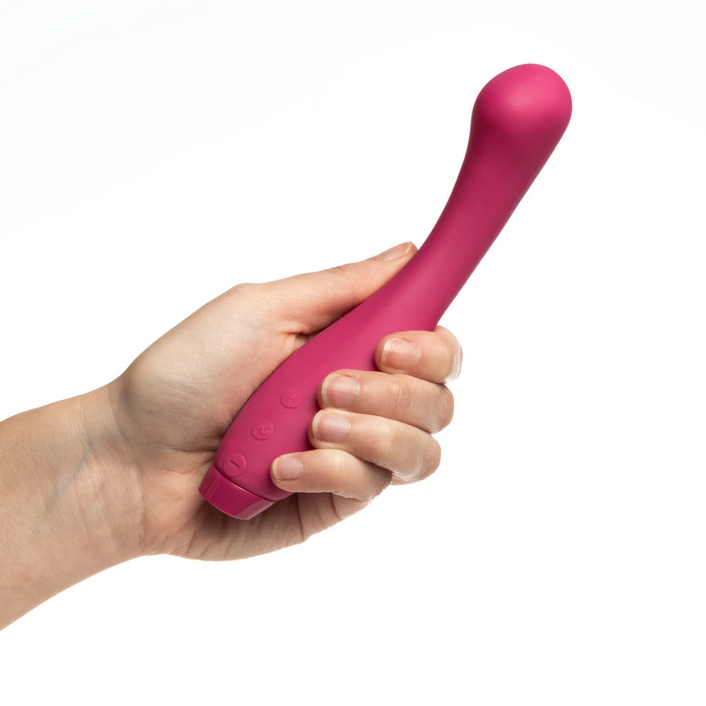 A sleek, fuchsia-colored G-spot vibrator with a smooth, contoured design and a rounded tip.
