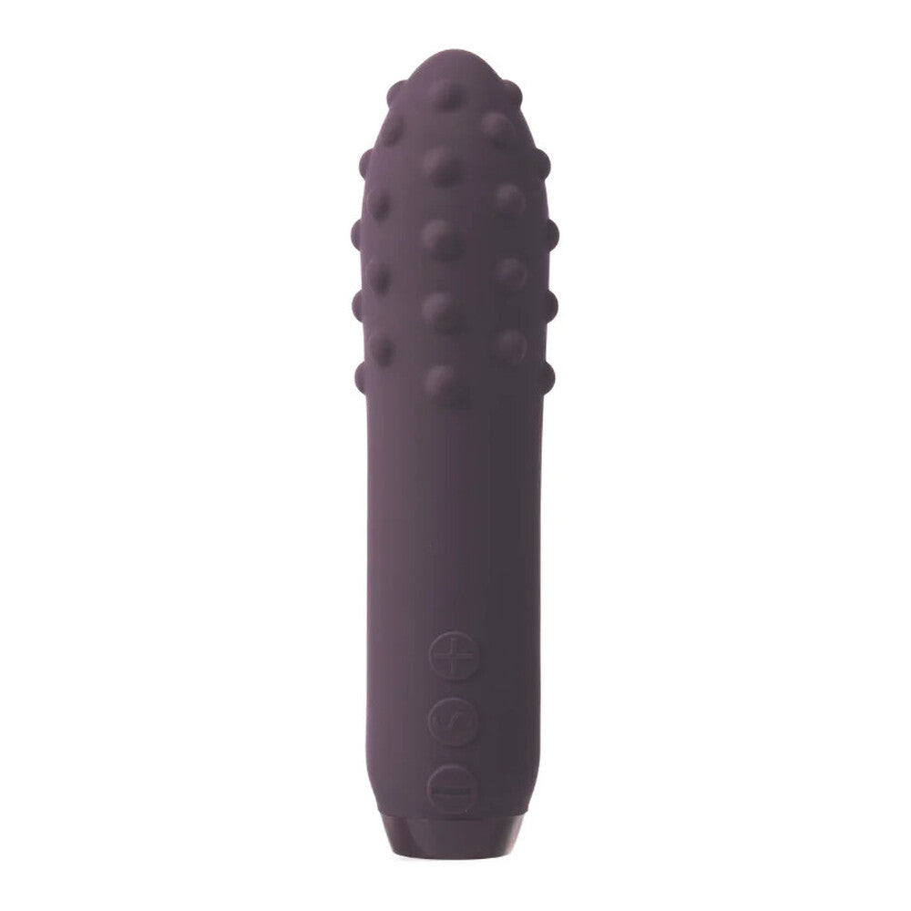 A purple, bullet-shaped vibrator with a textured, multi-surfaced tip and control buttons near the base.