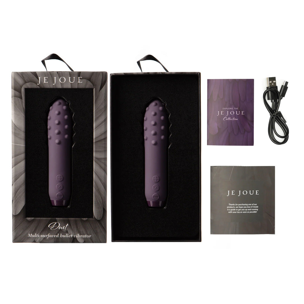 A purple, bullet-shaped vibrator with a textured, multi-surfaced tip and control buttons near the base.