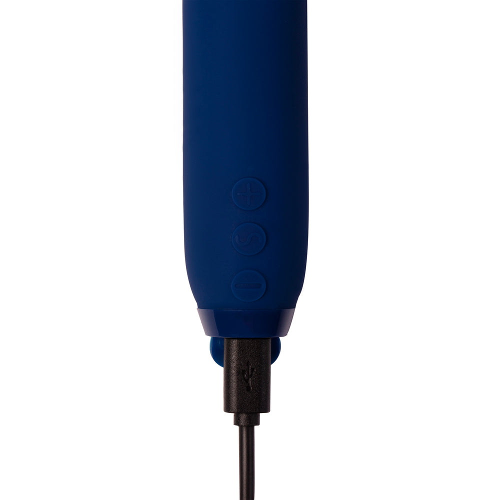 A navy blue, sleek and modern bullet vibrator with a rounded tip and a built-in control panel.