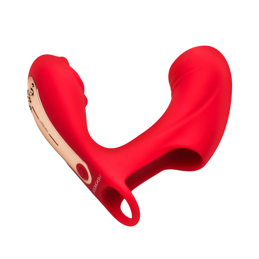 A red, silicone finger vibrator with a rose-shaped tip, being held between fingers, showing the flexible ring at the base.