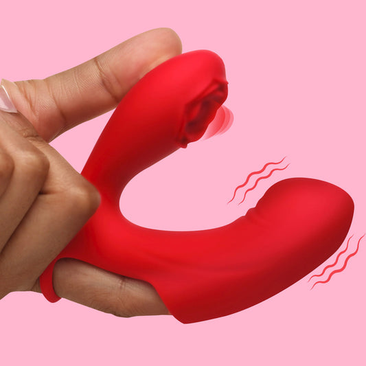 A red, silicone finger vibrator with a rose-shaped tip, being held between fingers, showing the flexible ring at the base.