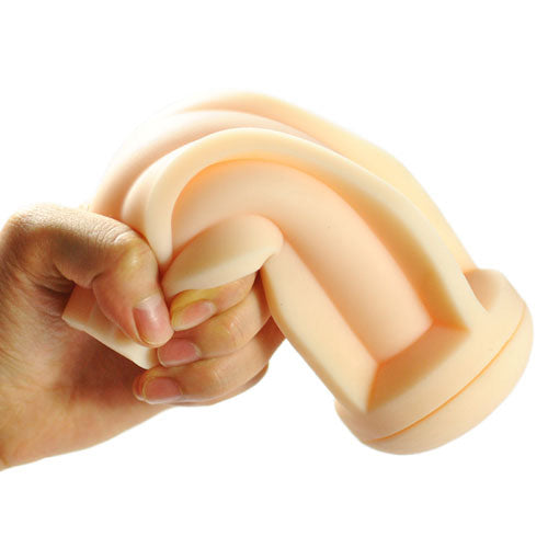 Hand holding and stretching a stretchy beige object on a white background