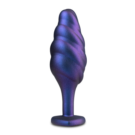 Purple metallic swirl-shaped object on a white background