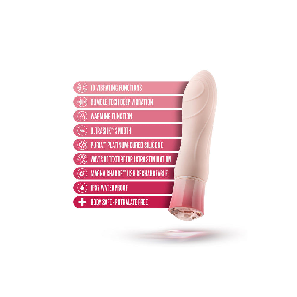 A pink vibrator with a rounded end and a gemstone-look base, showing the product partially disassembled to reveal the internal components.
