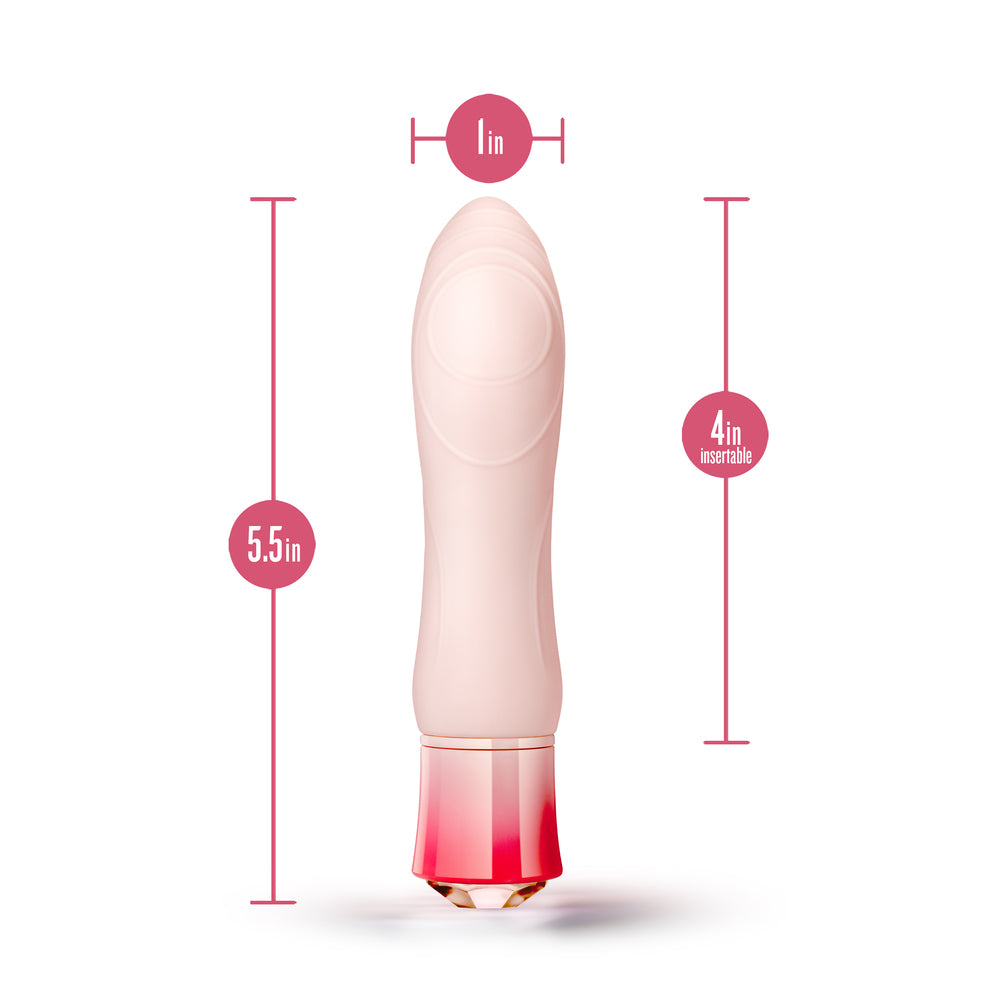 A pink vibrator with a rounded end and a gemstone-look base, showing the product partially disassembled to reveal the internal components.