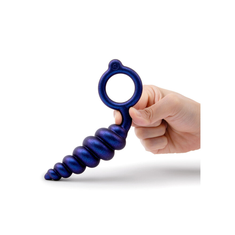 Hand holding a blue massage tool against a white background