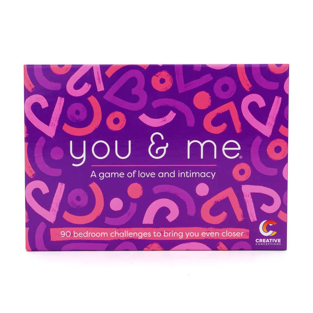 The product image shows the packaging of the "You and Me Game," which is designed with a purple background featuring hearts and text. The box contains various game cards, including 90 bedroom challenges, aimed at spicing up intimate moments.