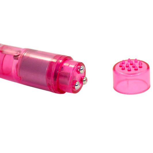 A small pink vibrator with four different changeable heads, showing the device's multiple components laid out separately.