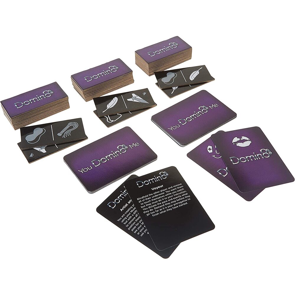 The image shows the board game Domin8, which includes a game box, domino-like cards, and scenario cards with a purple and black color scheme.