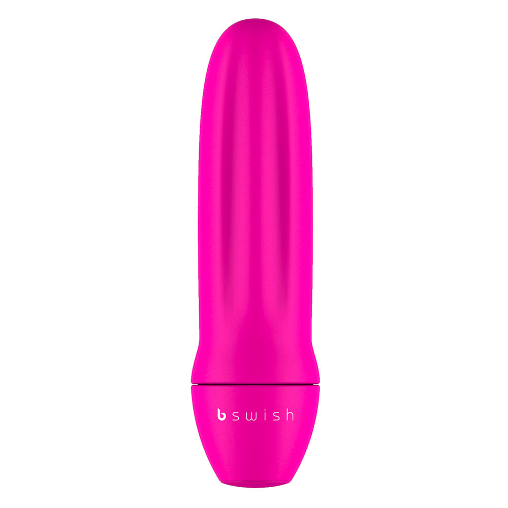 A pink, cylindrical mini vibrator with a smooth surface and the bswish brand logo near the base.