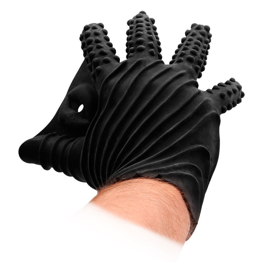 A black textured silicone glove for masturbation, shown in use with dotted textures on the fingers and a ribbed design for extra stimulation.