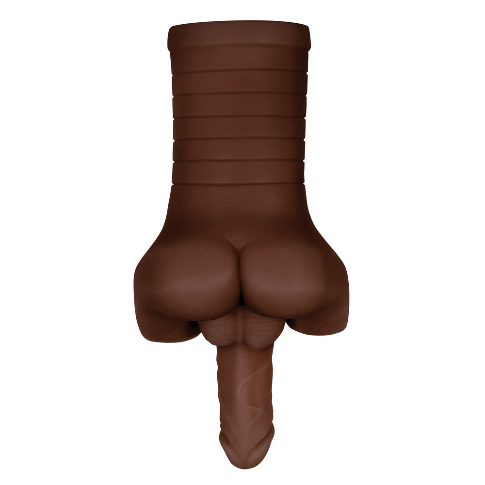 Brown rubber toy shaped like a buttocks on a white background