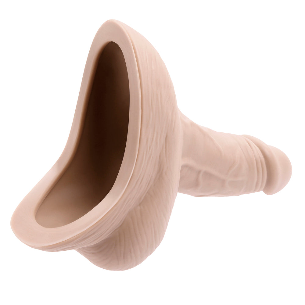 Beige silicone butt plug on a white background