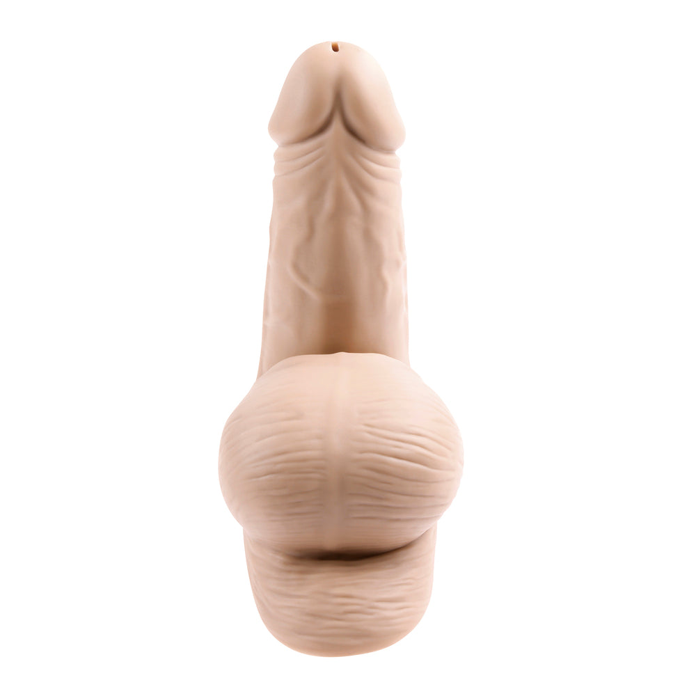 Beige silicone butt plug on a white background