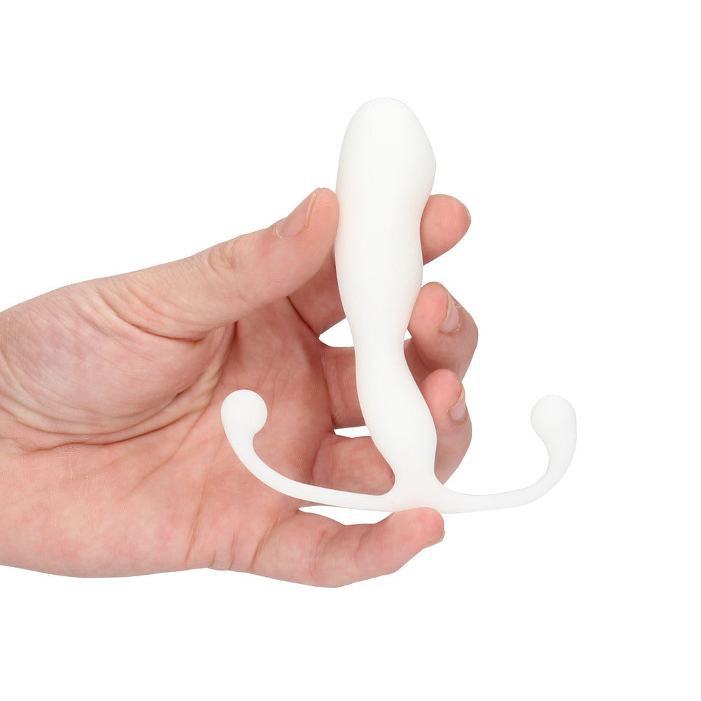 Hand holding a white silicone product on a white background