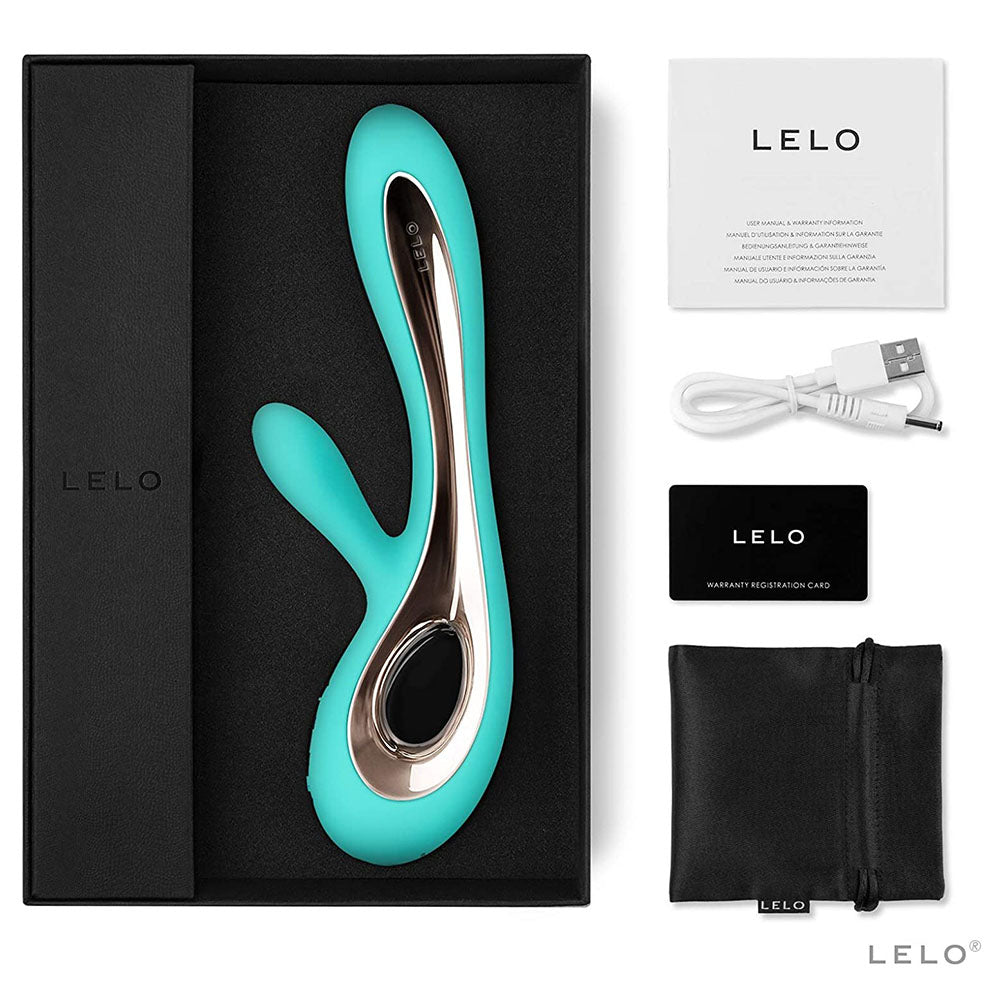 Turquoise and silver device with LELO branding, packaging, and accessories on a white background.