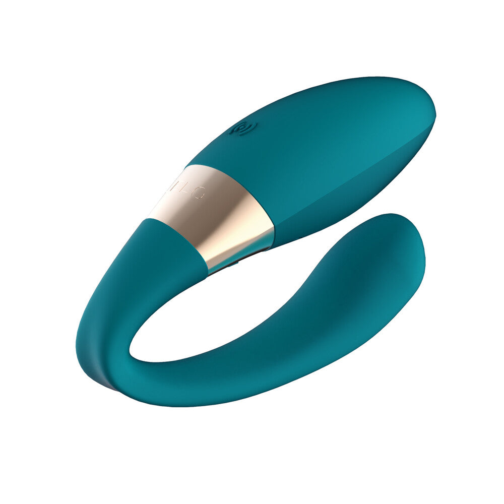 Teal ring with gold accent on a white background