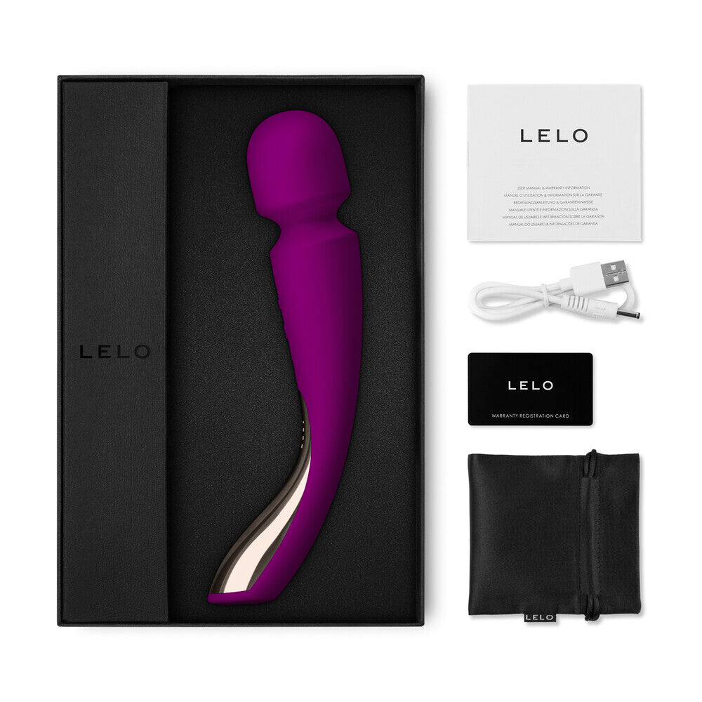 Purple electronic device in a black box with Lelo branding, including a USB cable and user manual.