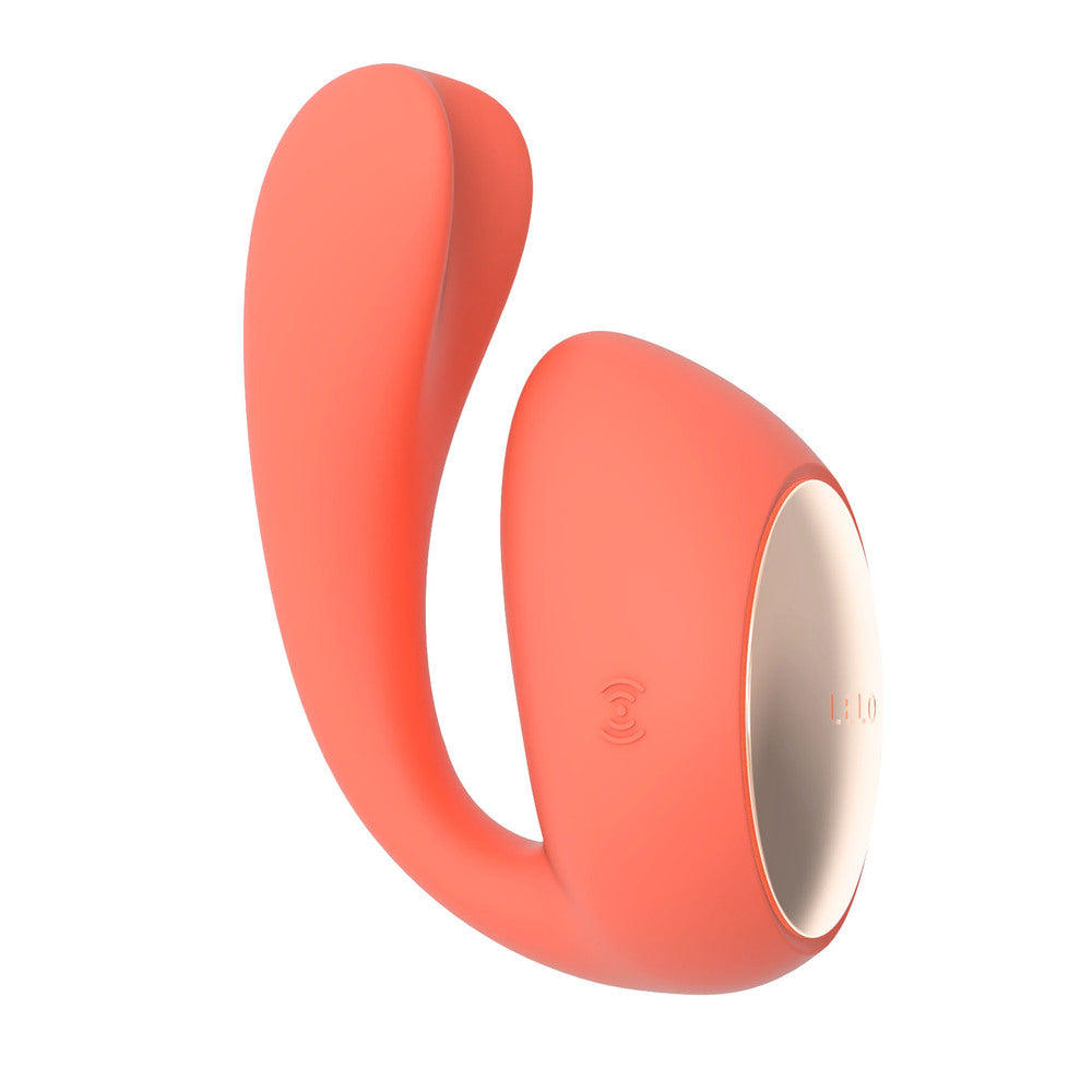 Coral-colored silicone ring with a white interior on a white background