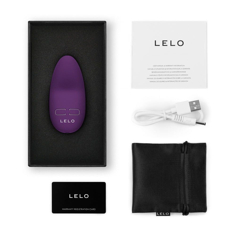 Purple LELO product with packaging, USB cable, and warranty card on a white background
