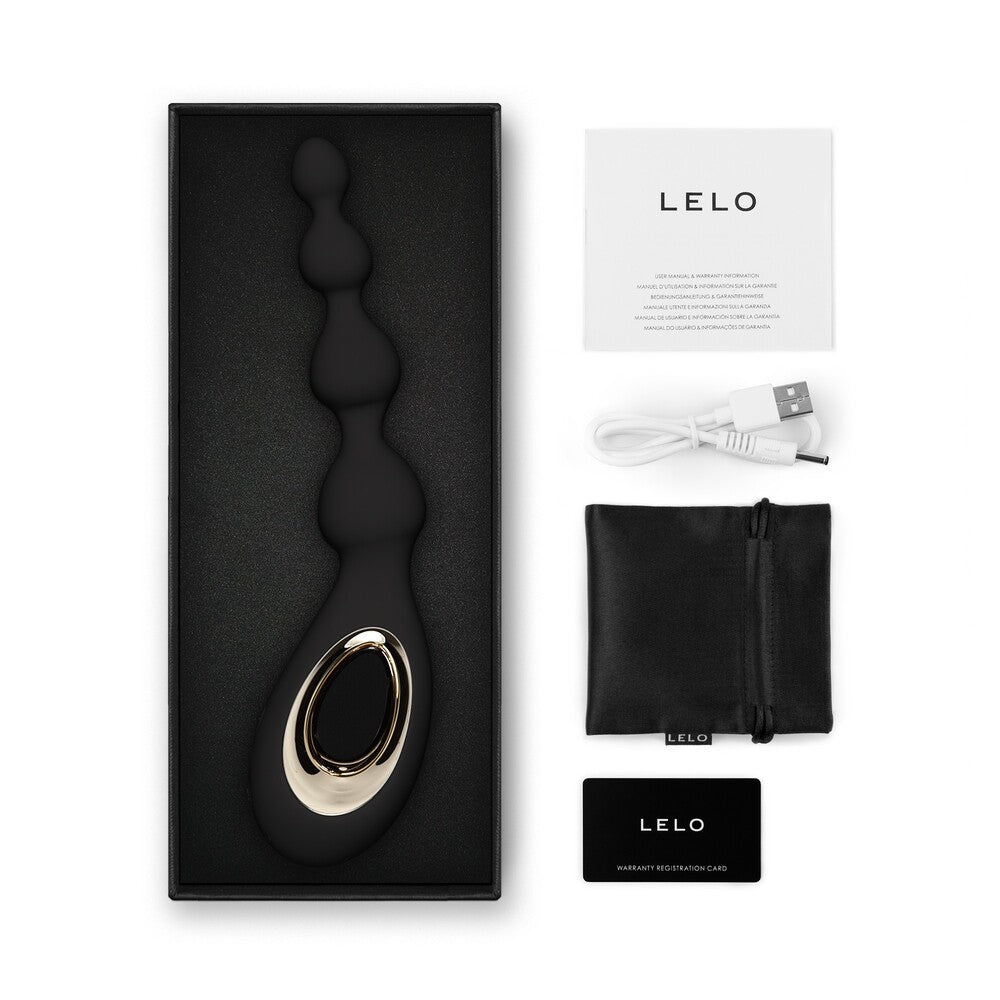 LELO product with packaging, USB cable, and pouch on a white background