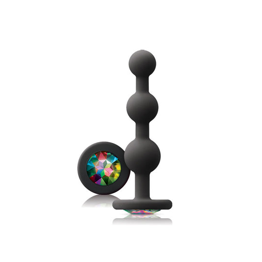 Black silicone butt plug with colorful gem on a white background