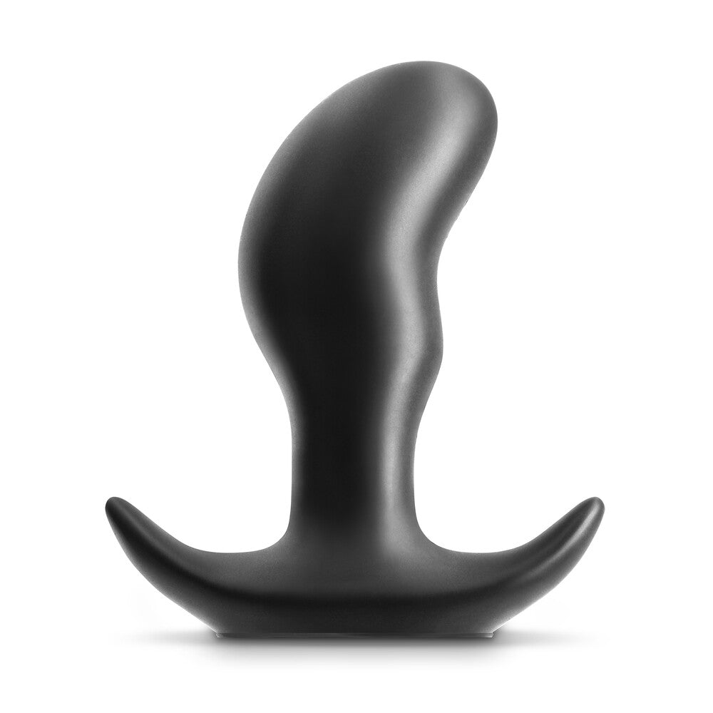 Black, abstract sculpture on a white background