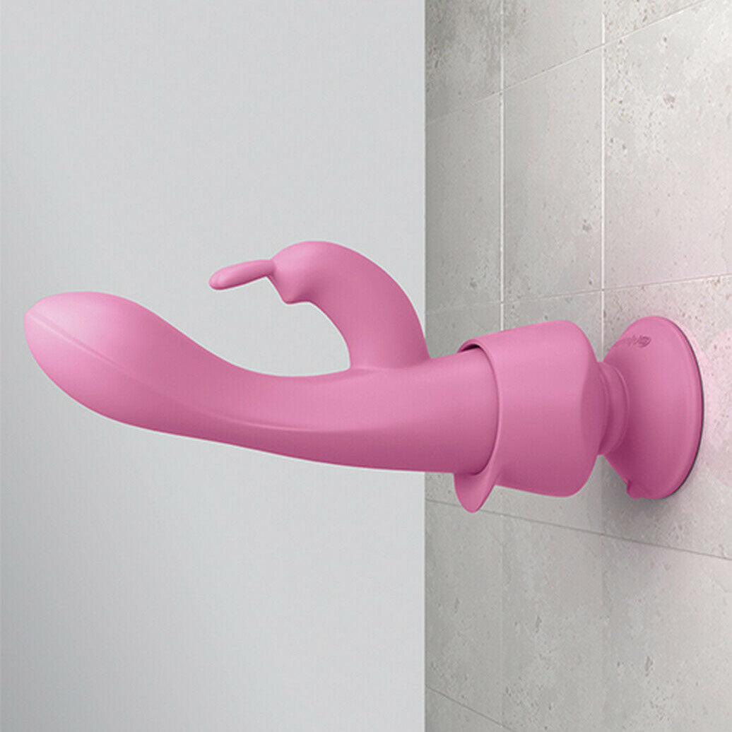 A pink rabbit style vibrator with a magnetic wireless remote and a silicone suction cup base.