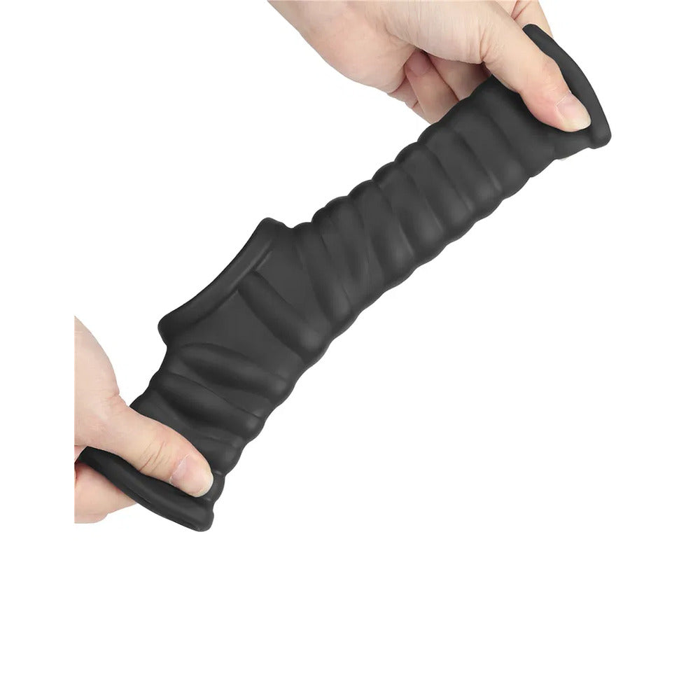Black textured grip handle held by a hand on a white background