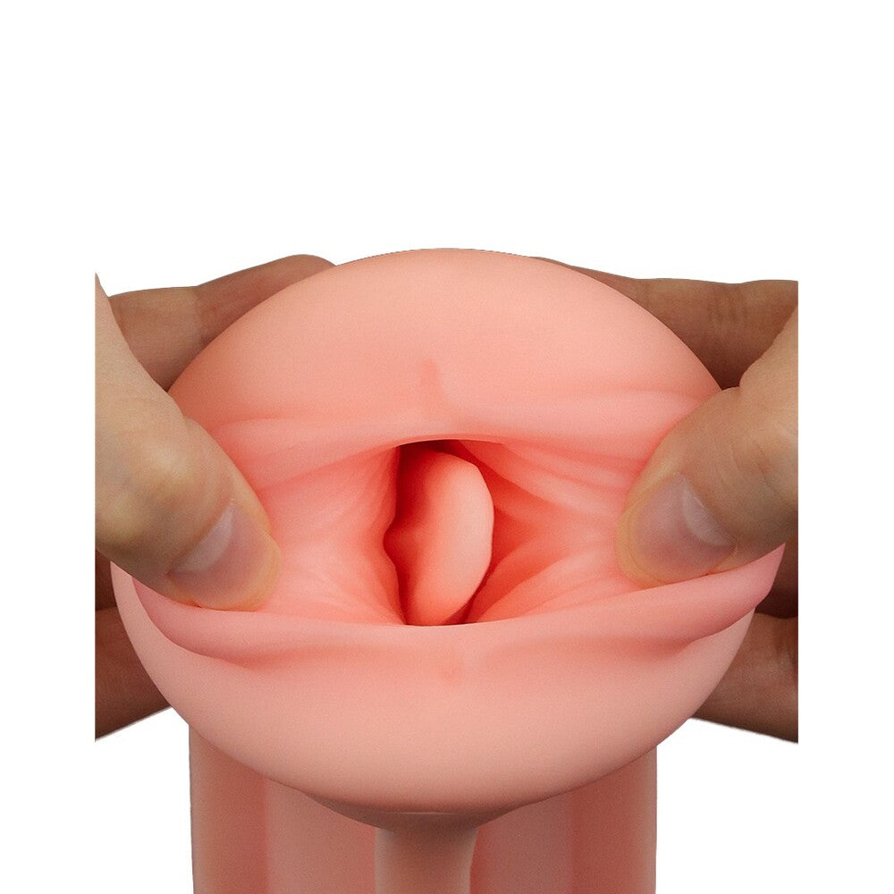 Pink silicone ring held between fingers on a white background