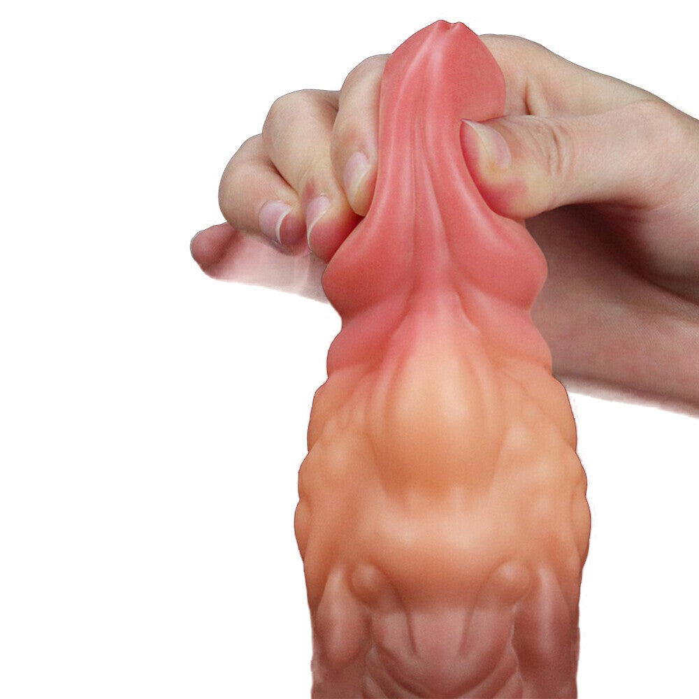 Hand squeezing a pink silicone product on a white background