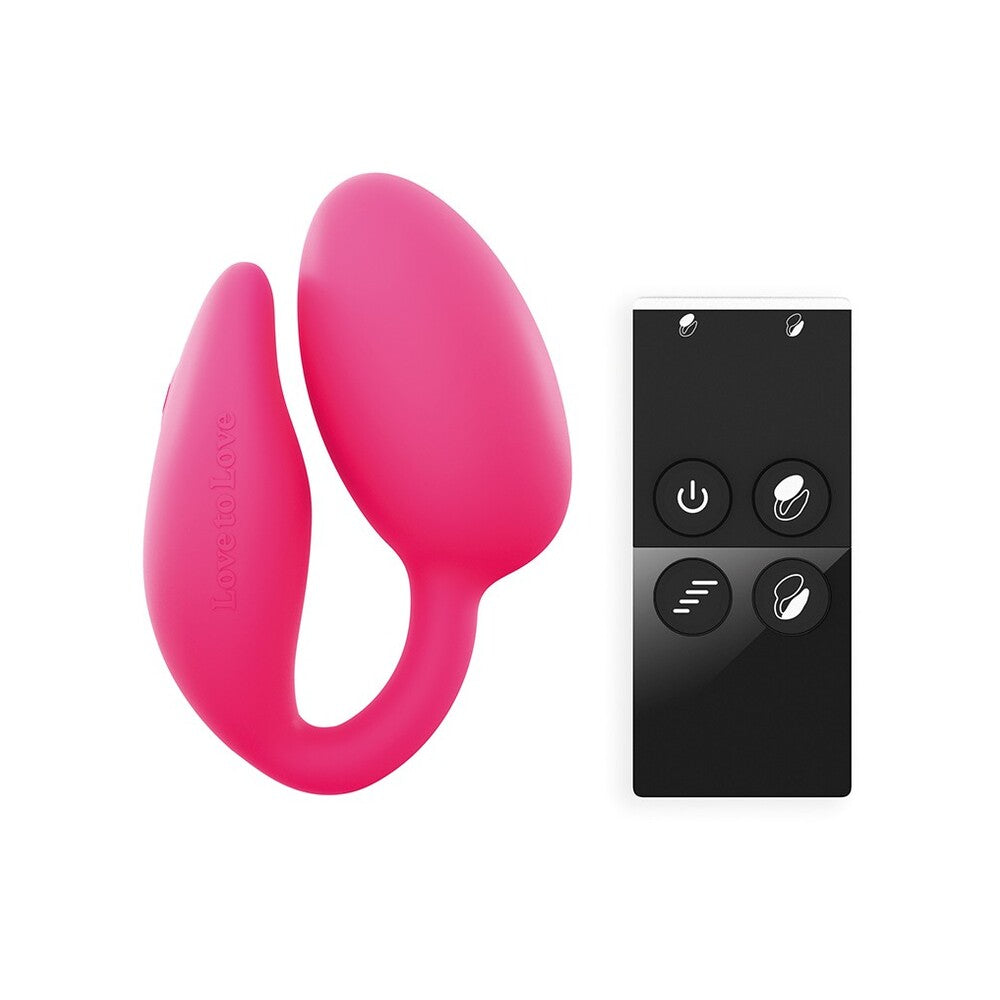 A pink remote-controlled double stimulator with a clitoral stimulator and a G-spot stimulator, alongside a black remote control with buttons for power and vibration modes.