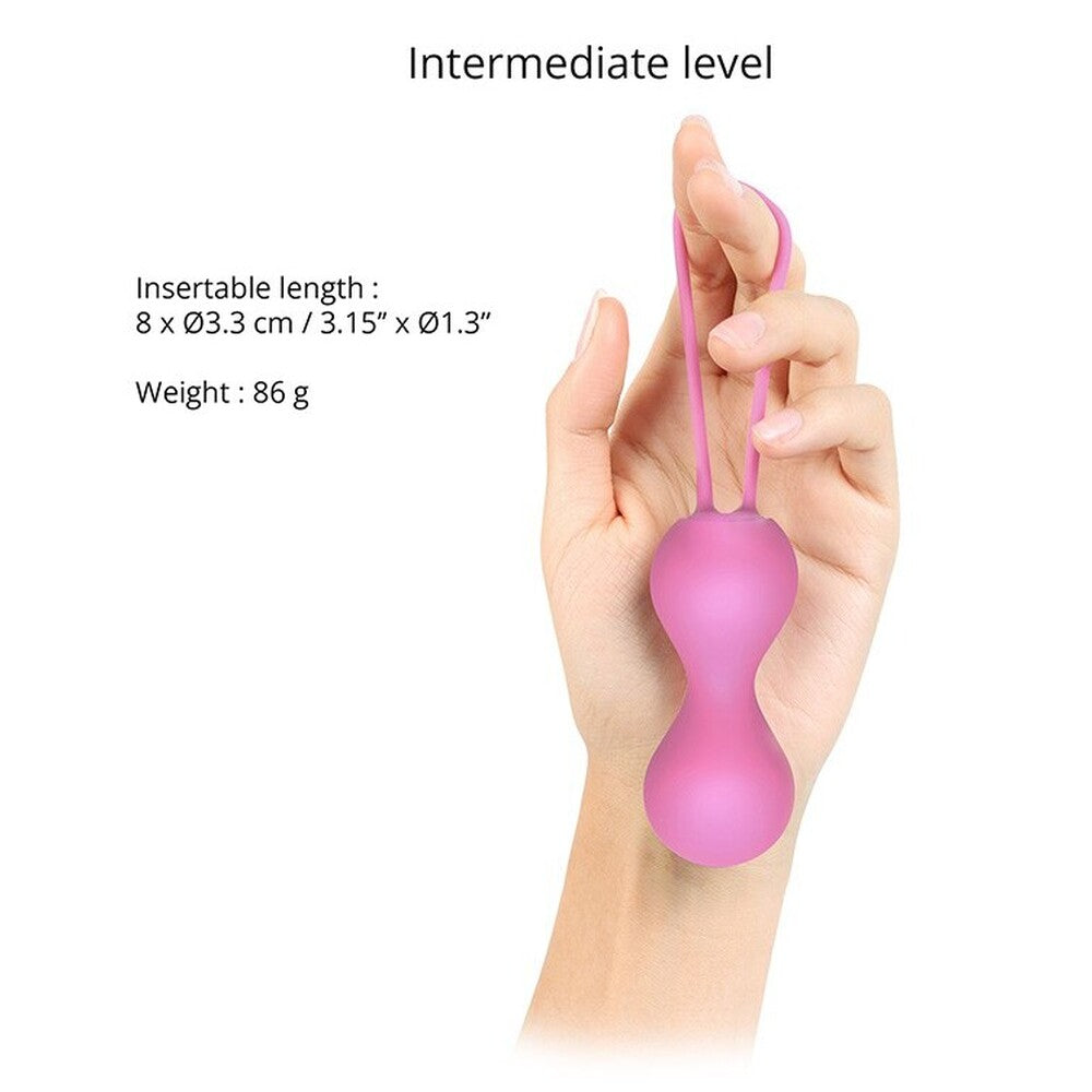 A pink silicone kegel ball with a silicone string, designed to strengthen pelvic floor muscles.