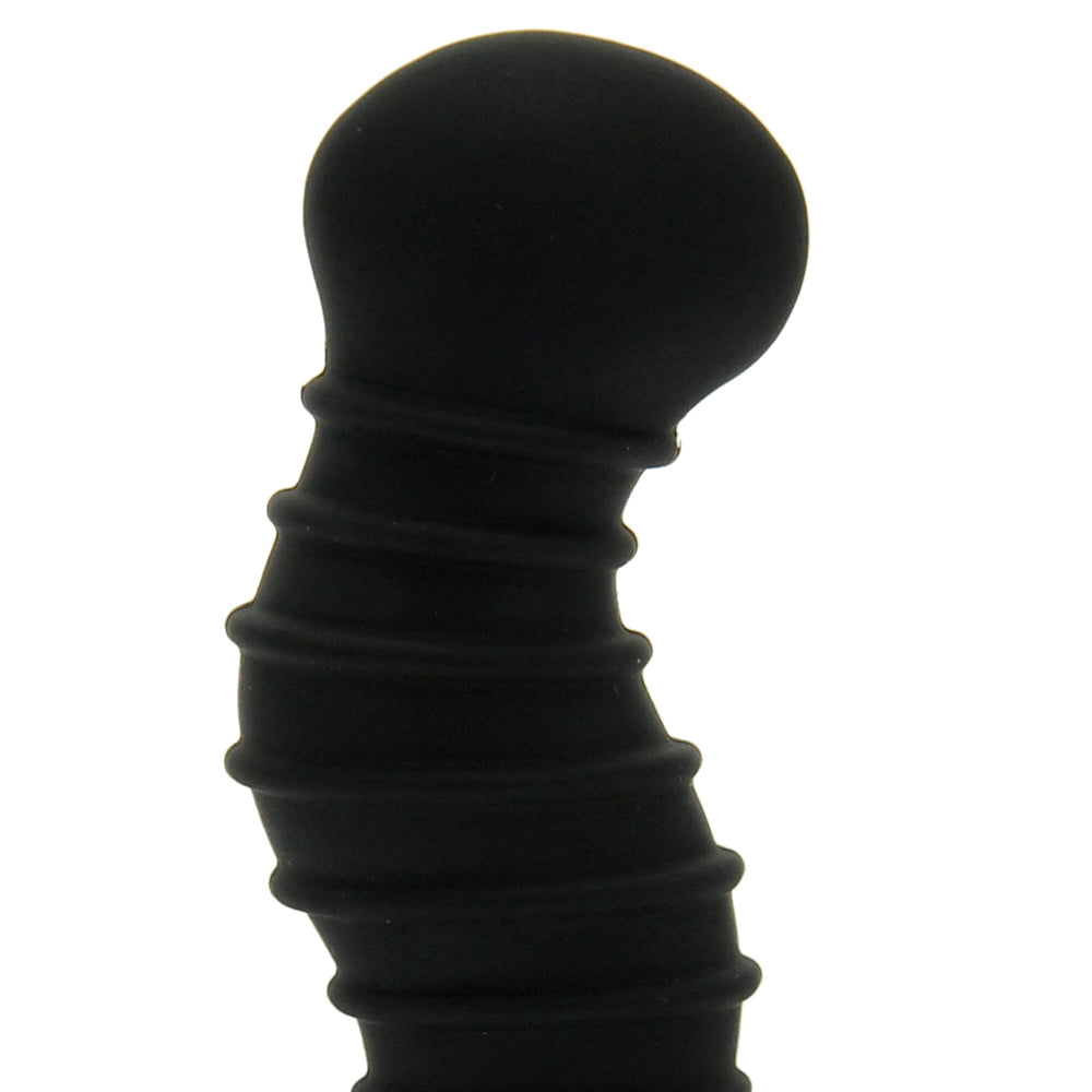 Black silicone butt plug on a white background