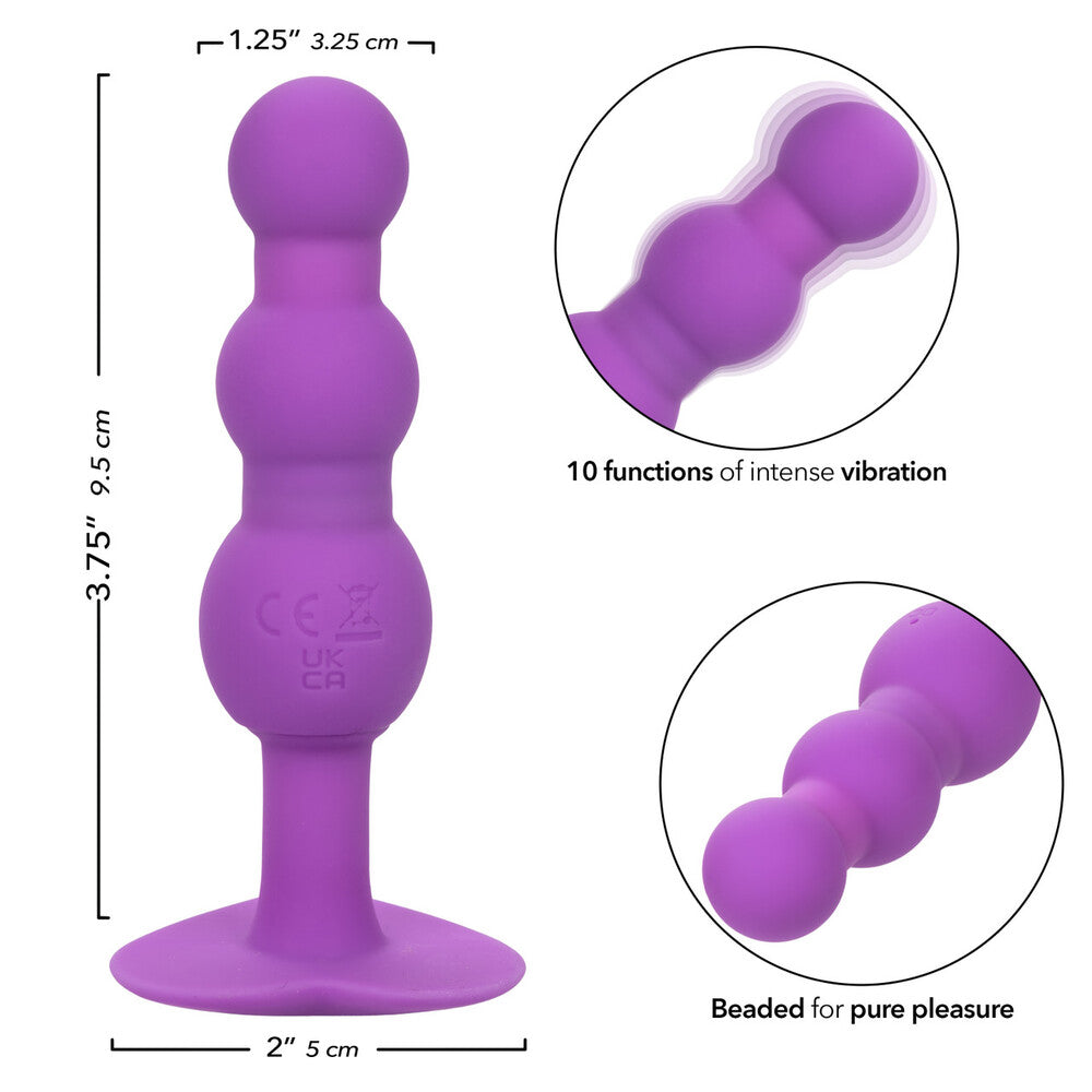 Purple silicone toy with measurements and features on a white background