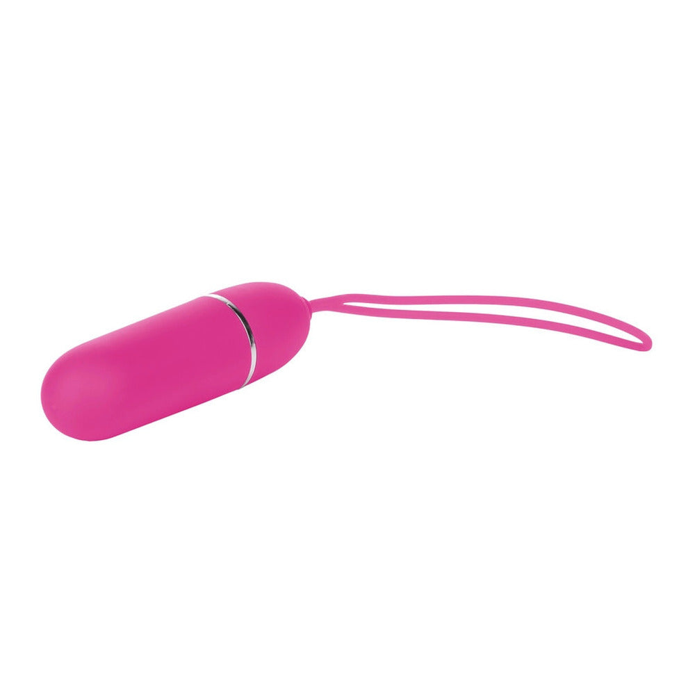 Pink cylindrical object with a string on a white background