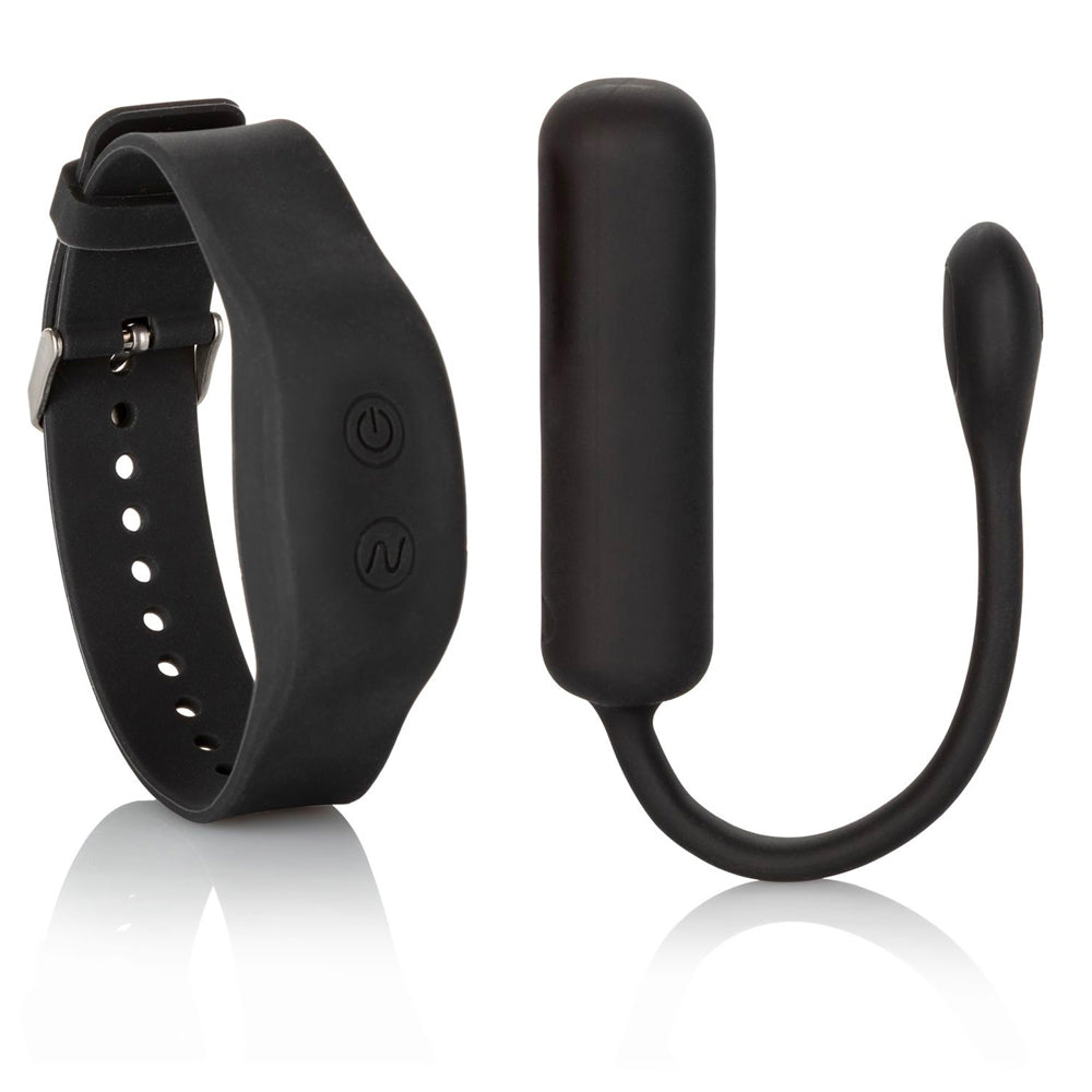 The image shows a black wristband remote controller paired with a small black bullet vibrator. The wristband has a sleek, silicone band with two buttons for controlling the vibrator.