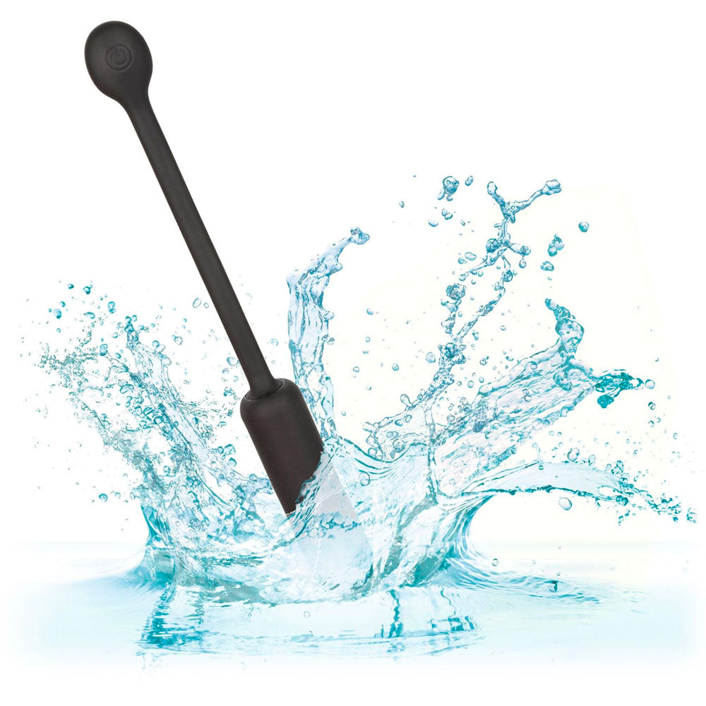 Black paddle stirrer in water with splashes on a white background