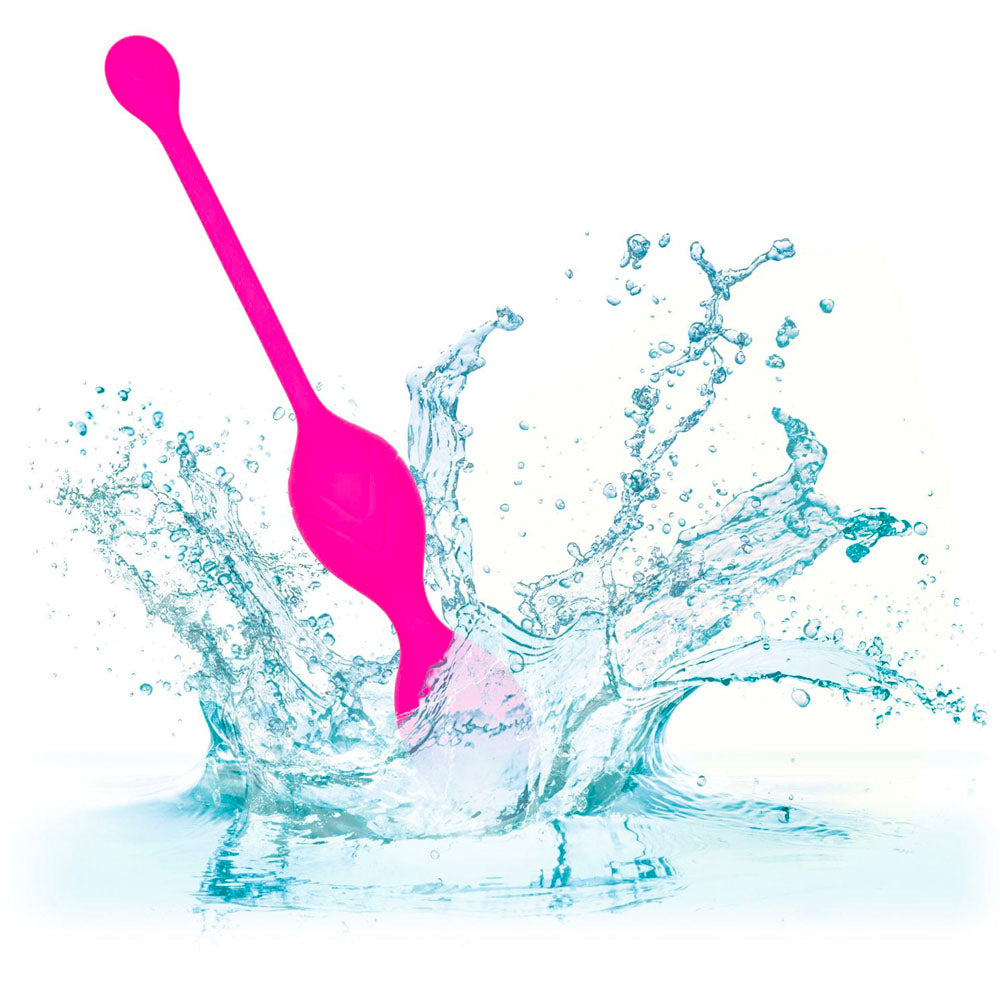 Pink tool with water splashes on a white background