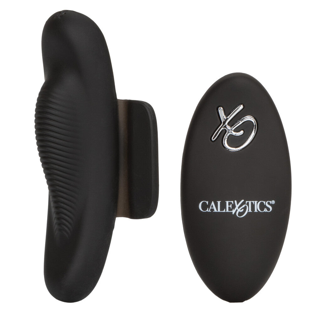 A black, firm silicone remote control petite panty teaser with ridges for stimulation. It includes a remote controller featuring the California Exotic brand logo.