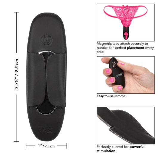 Black remote control with magnetic tabs and hand holding it.