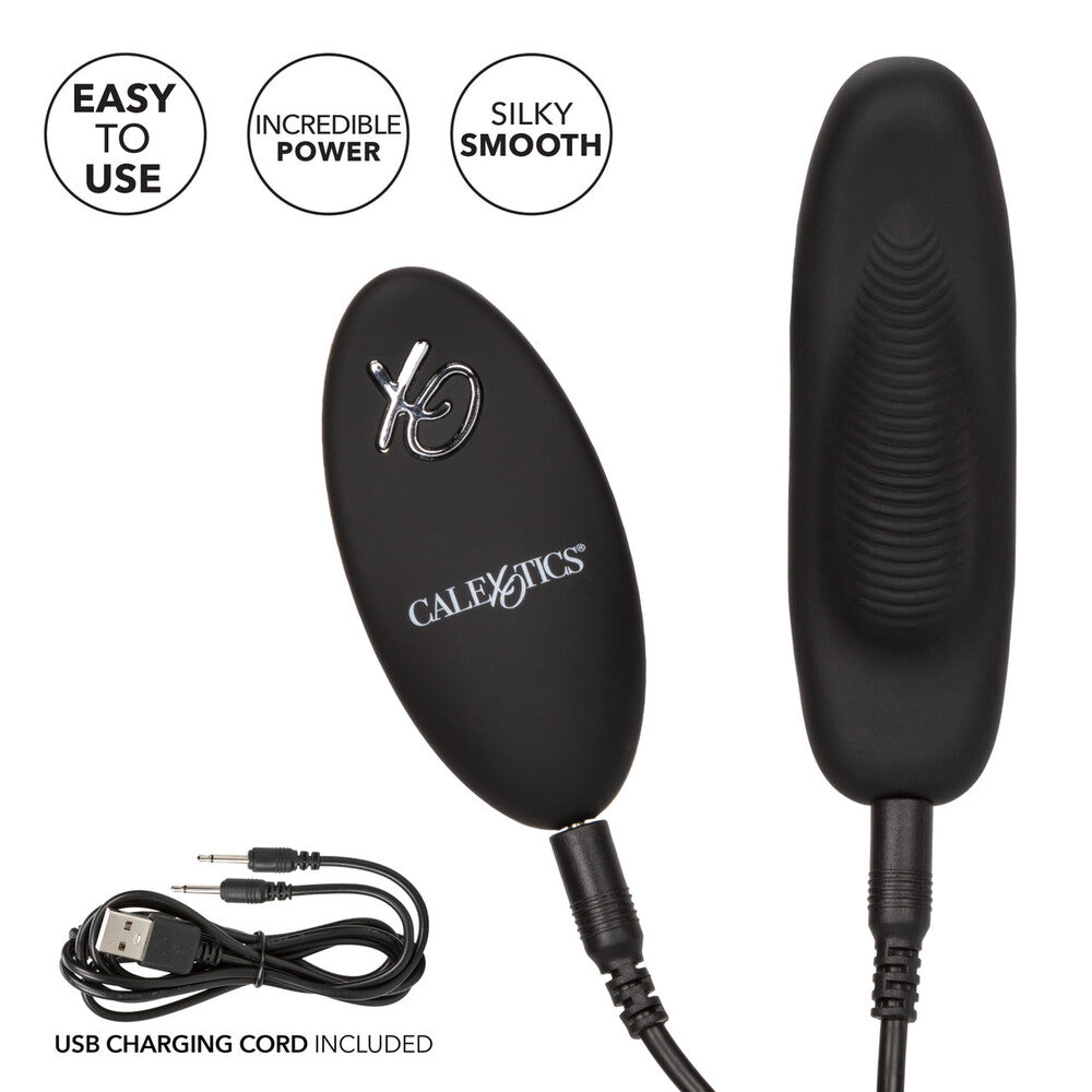 Black electronic device with USB charging cord on white background