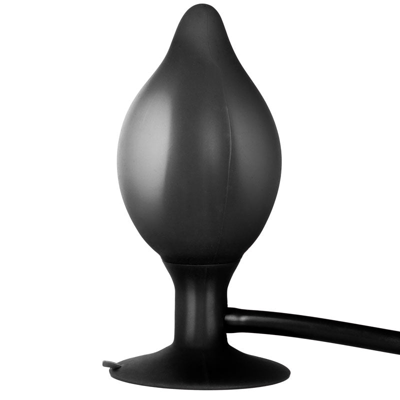 Black silicone butt plug on a white background