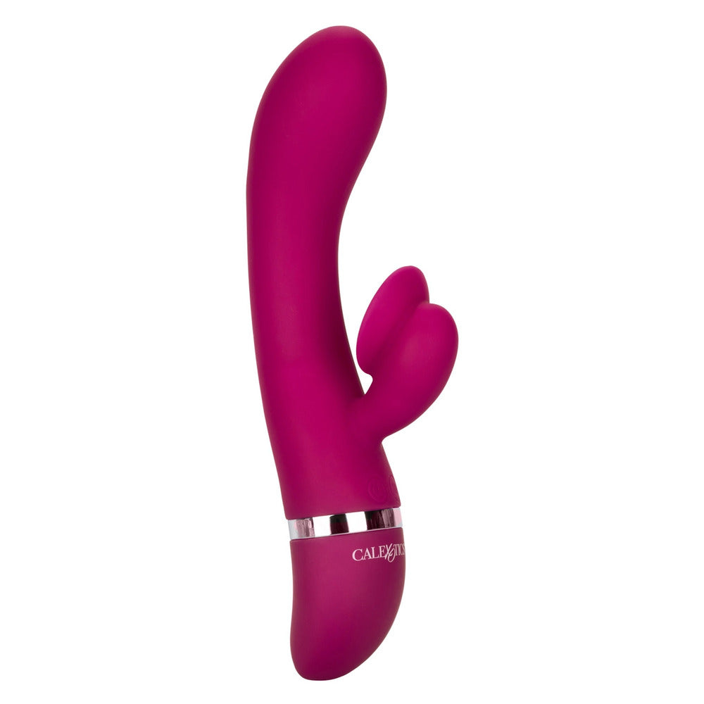 A purple, dual stimulator vibrator with a curved design and a small protrusion at the top. The handle is sleek with a metallic band near the base and labeled with the brand name 'California Exotic Him or Her'.