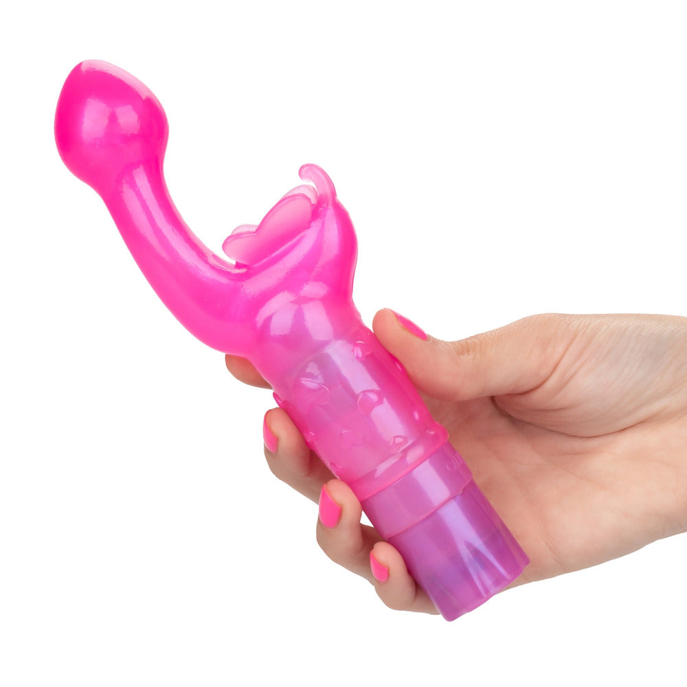 A hot pink, curved G-spot vibrator with a smooth tip and a butterfly-shaped extension at the base. The stimulator is made from soft, flexible TPR and has a decorated shaft.