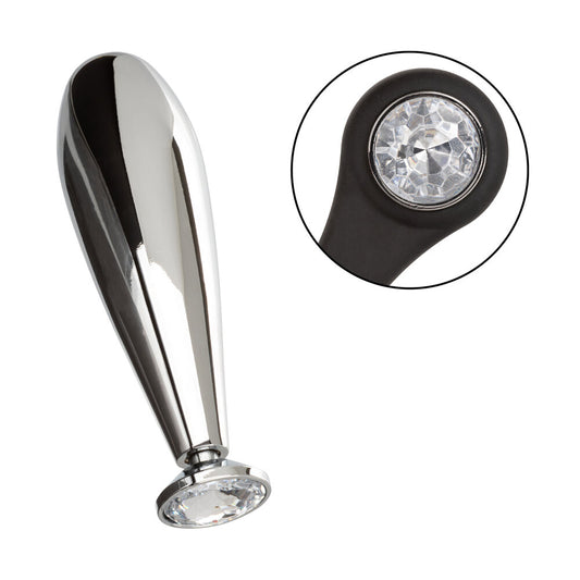 Metallic object with a crystal-like top on a white background