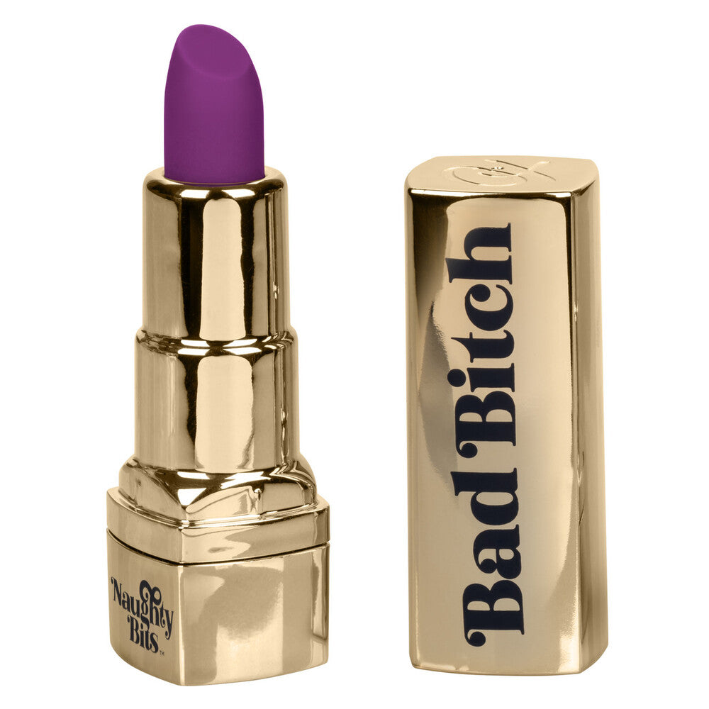 A gold lipstick-shaped vibrator with a deep purple tip, branded 'Bad Bitch' on the shiny casing.