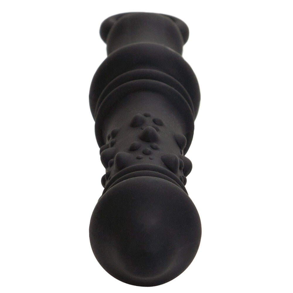 Black silicone butt plug with textured design on a white background